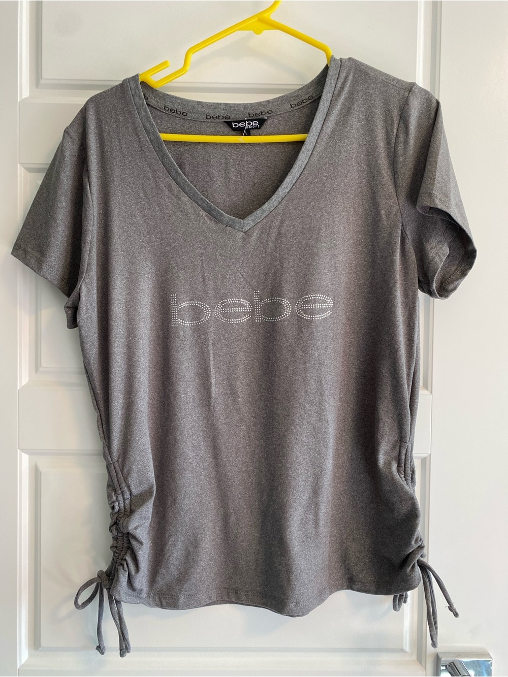 NWOT BEBE Gray V-Neck Tee with Rhinestones Side Drawstring and Logo